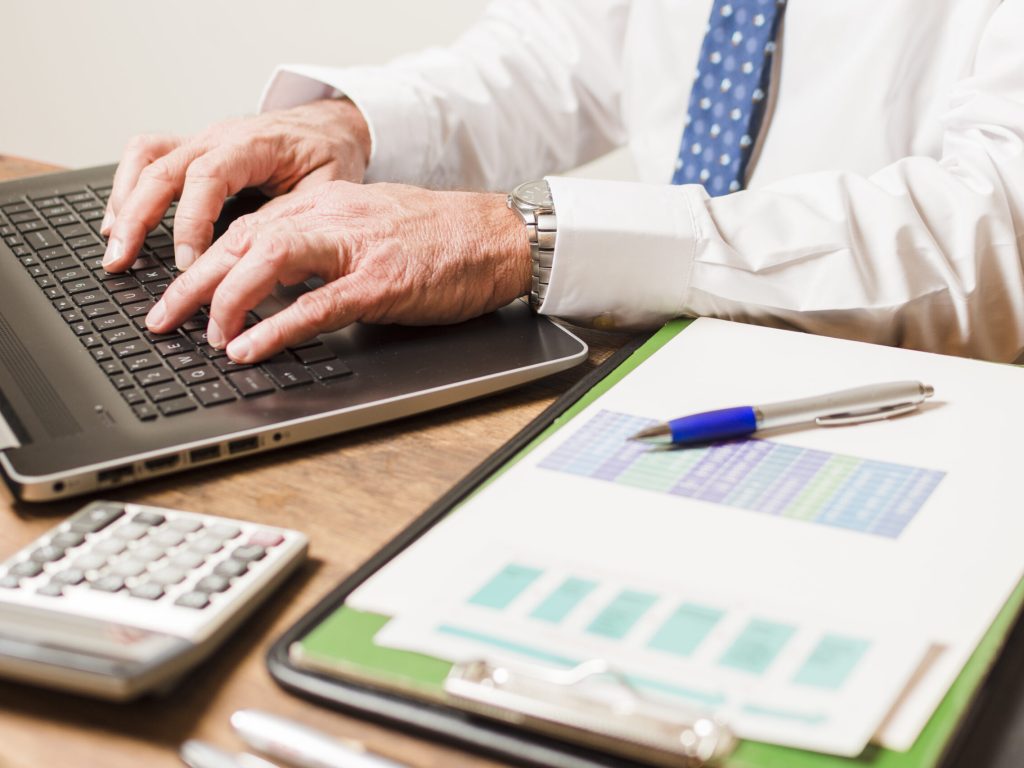 businessman-writing-laptop